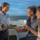 Cairns-Reef-Tours---guests-enjoy-a-glass-of-wine